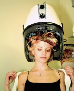 Woman under hair dryer
